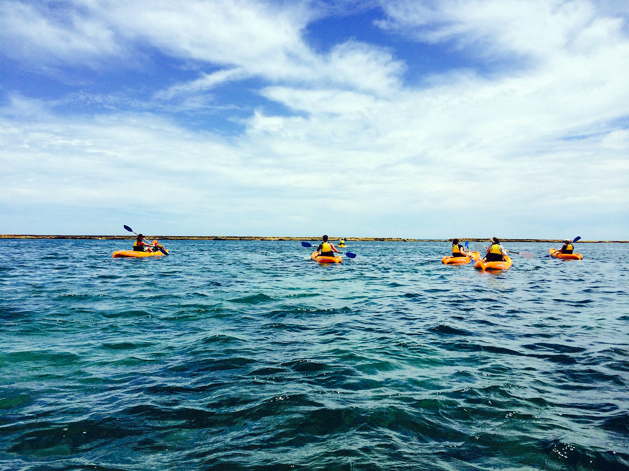 Kayakers paddling near Port Noarlunga jetty and reef