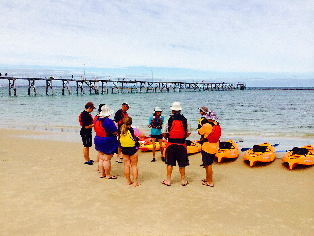 Kayakers spread across clear water at Port Noarlunga Reef